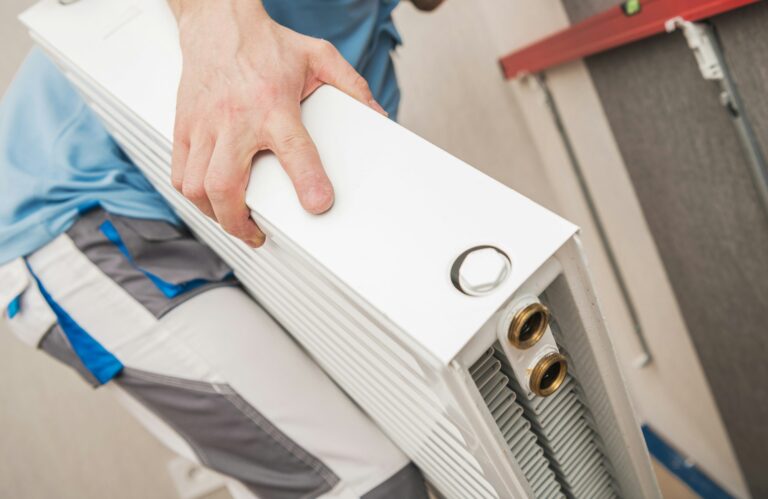 Technician working on a heating radiator
